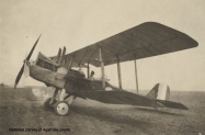 Pilot_of_3_Squadron_Australian_Flying_Corps_seated_in_the_cockpit_of_a_Royal_Aircraft_Factory_RE8_A_3641_biplane_France_1917_NLA